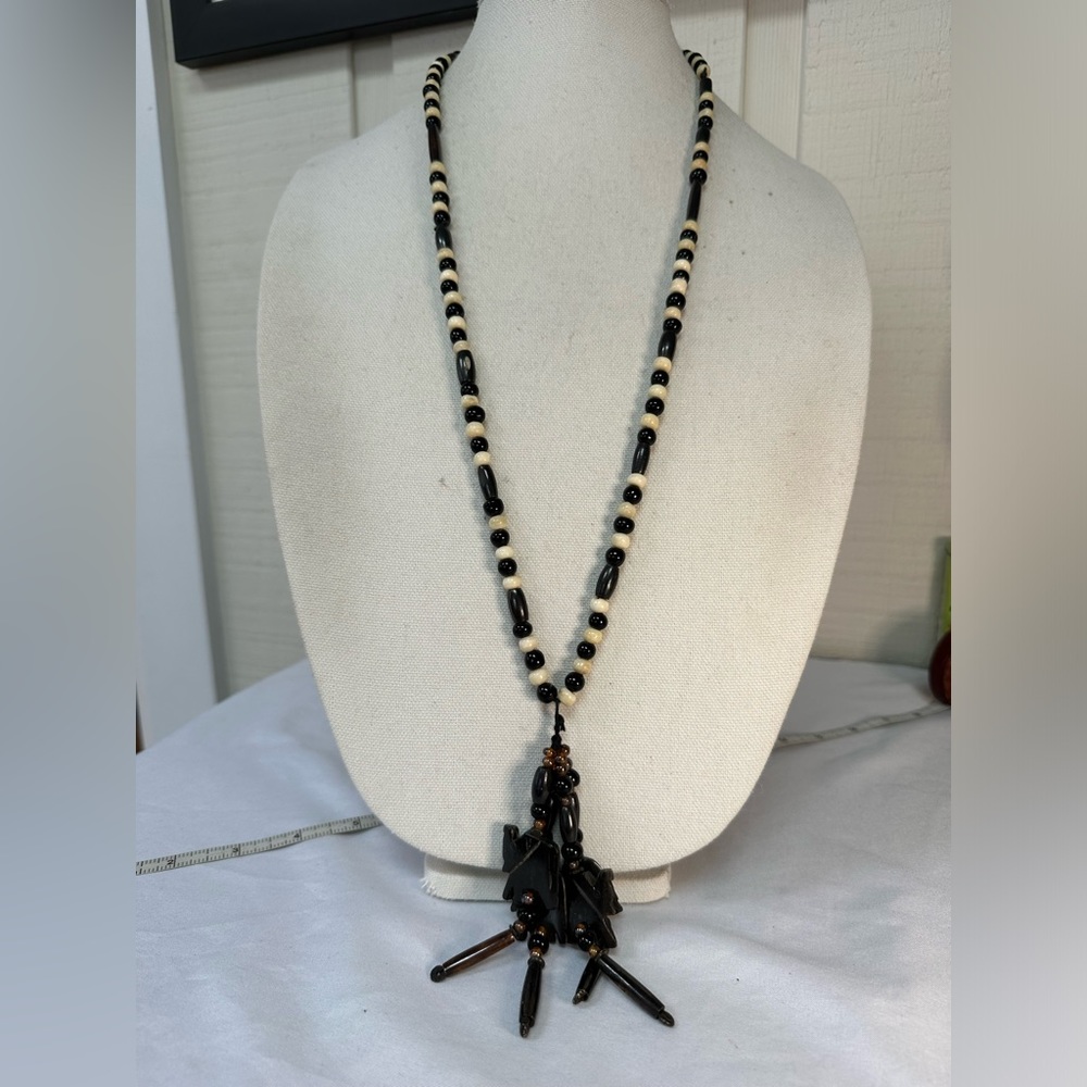 Ethnic fetish elephant necklace in black and beige
